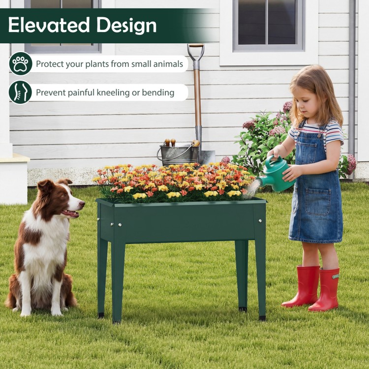 Elevated green metal gardening box with legs, ideal for growing flowers and herbs while preventing bending or kneeling.