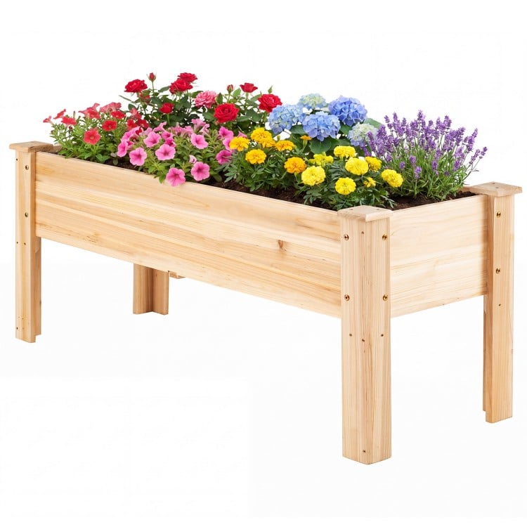 Elevated planter box made of solid fir wood, featuring vibrant flowers, perfect for outdoor gardening and vegetable.