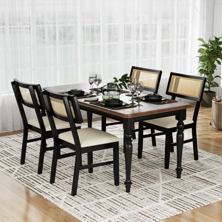 Black rattan dining chairs set with padded seats and rubber wood legs, perfect for stylish kitchen dining.