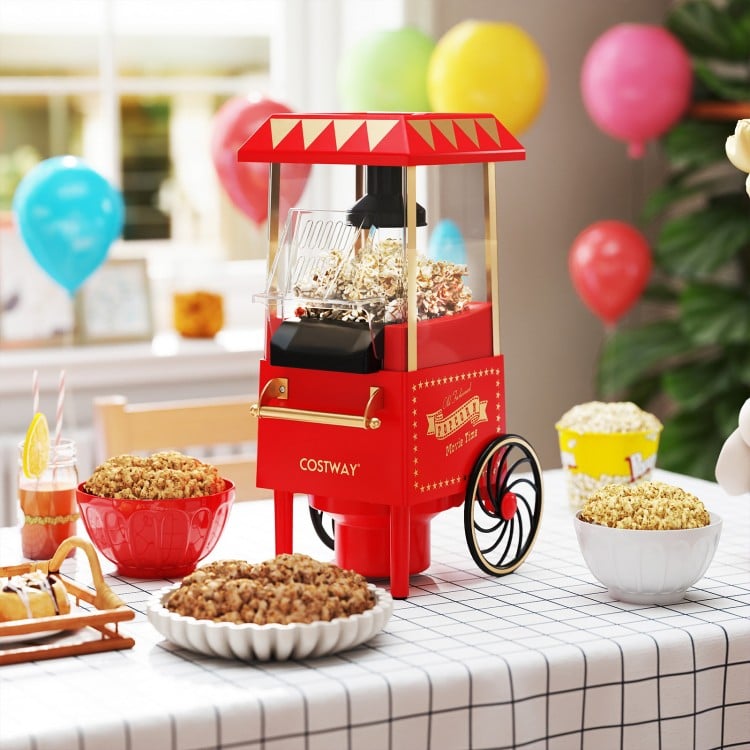 Retro hot air popcorn maker in red with measuring cup, perfect for oil-free popcorn at family gatherings and movie.