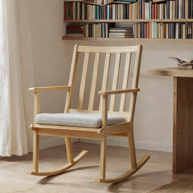 Natural solid rubber wood rocking chair with padded seat and ergonomic backrest, ideal for reading and relaxation.