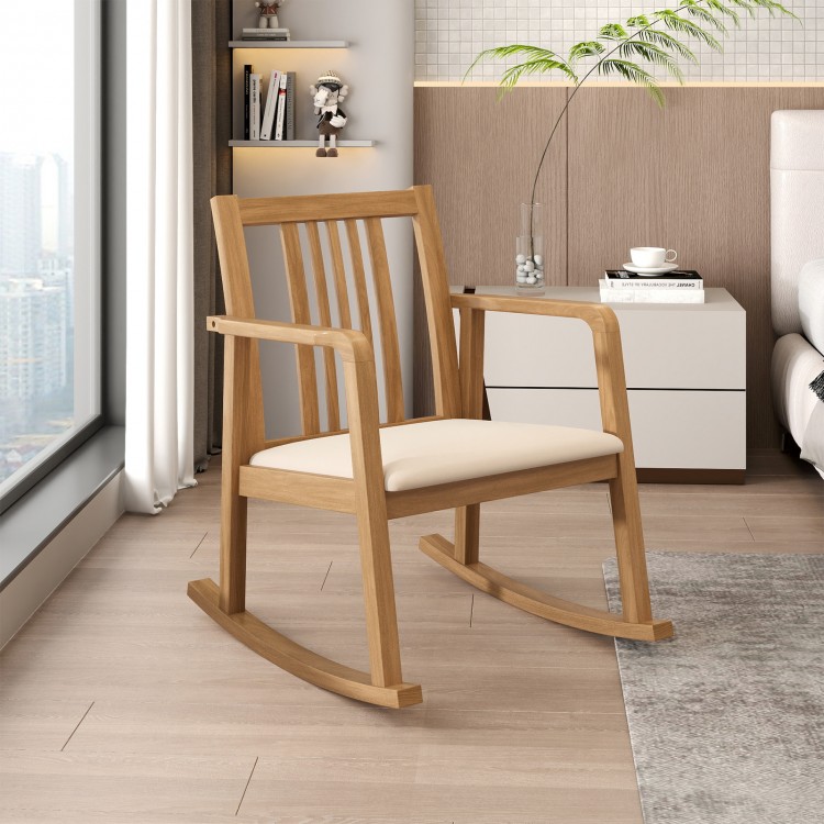 Natural rocking chair with slatted back, curved armrests, and soft linen seat, perfect for relaxation in any room.