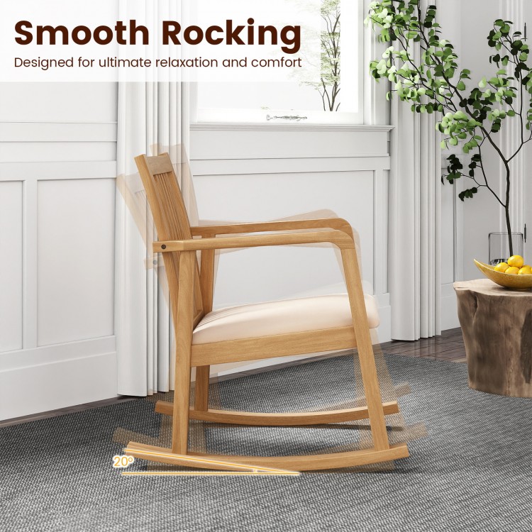 Natural rocking chair with slatted back, curved armrests, and soft linen seat for ultimate comfort and relaxation.