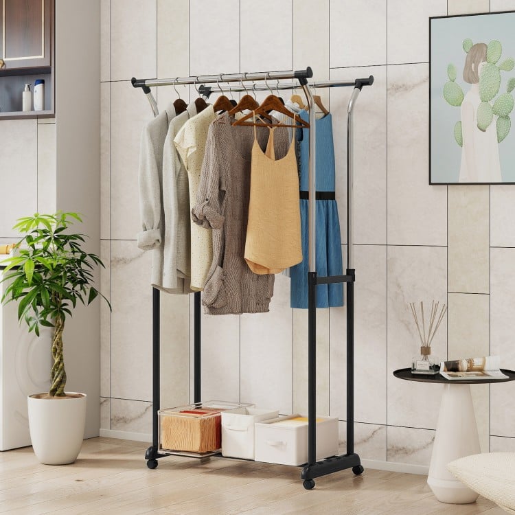 Double rod garment rack with adjustable height, heavy-duty metal, and smooth-rolling casters for easy mobility and.