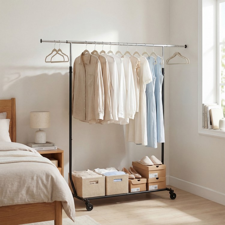 Extendable rolling clothes rack with hanging garments and storage bins, ideal for bedroom or laundry organization.
