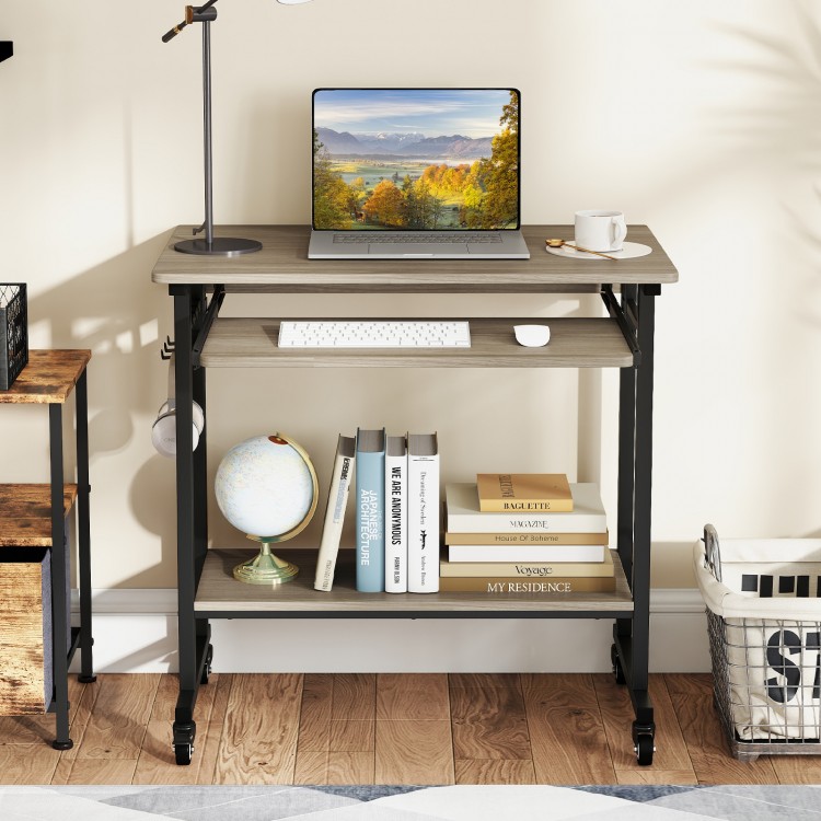 Rolling laptop table in grey with pull-out keyboard tray, hooks, and bottom shelf for convenient storage and mobility.