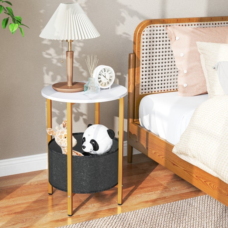 Round end table with a white top and gold metal frame, featuring a removable black felt basket for storage.