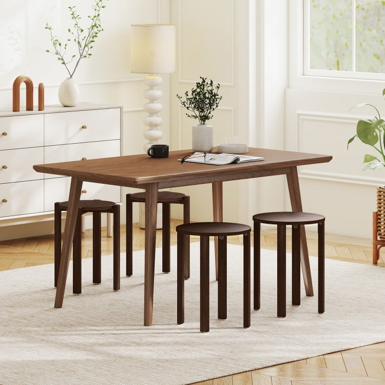 Round portable wood nesting stools in walnut finish, featuring locking casters for easy mobility and space-saving.