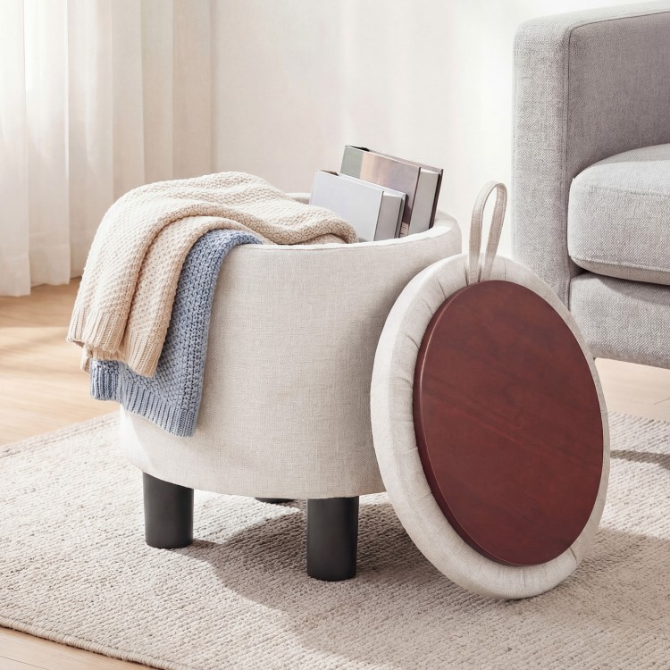 Round beige storage ottoman with removable lid, upholstered in linen fabric, perfect for blankets and books.