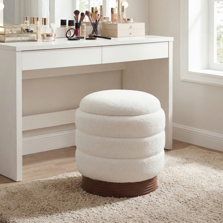 Round storage ottoman in white boucle fabric with acacia wood frame, featuring hidden storage and 360° swivel for.