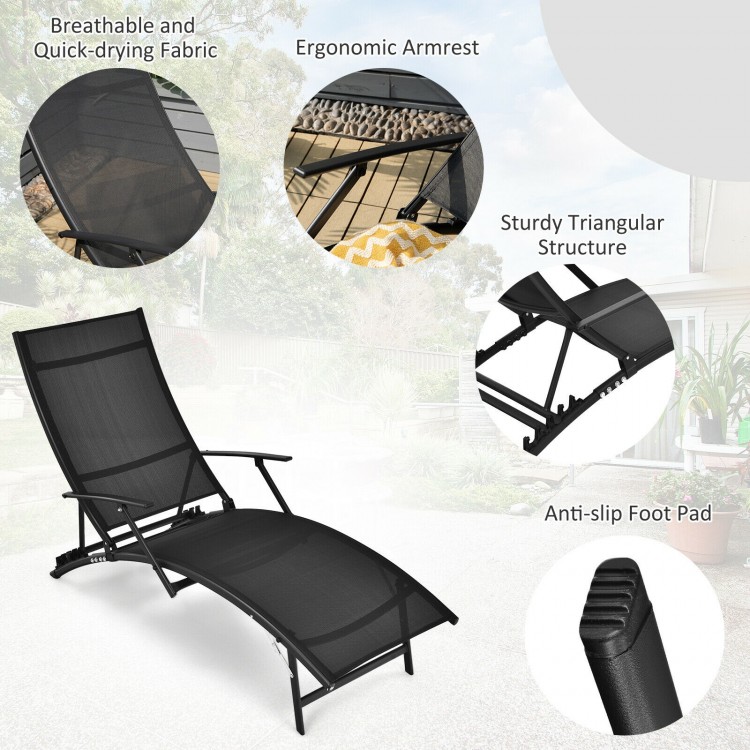 Black patio folding lounge chair with ergonomic armrest, adjustable backrest, and quick-drying fabric for outdoor.