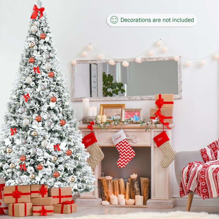 Snow flocked 8 feet Christmas tree with white berries and poinsettia flowers, perfect for festive home decoration.