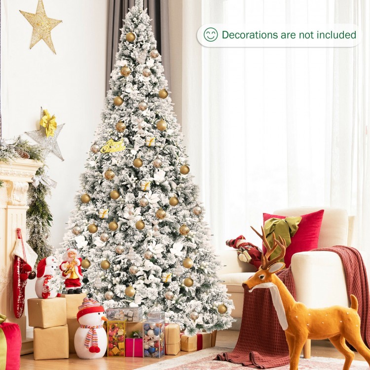 Snow flocked 8-foot Christmas tree with white berries and poinsettia flowers, perfect for festive holiday decor.