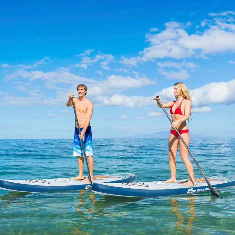 Two people paddle on a 10.5 feet inflatable stand-up paddle board in clear water, ideal for summer water activities.