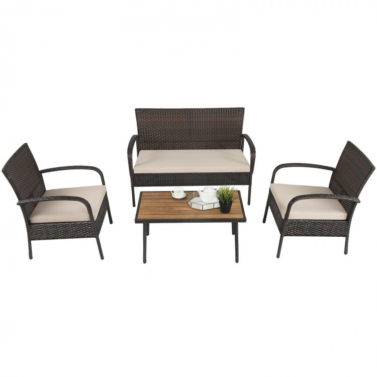 4-piece patio conversation set featuring cushioned wicker chairs and an acacia wood tabletop, perfect for outdoor.