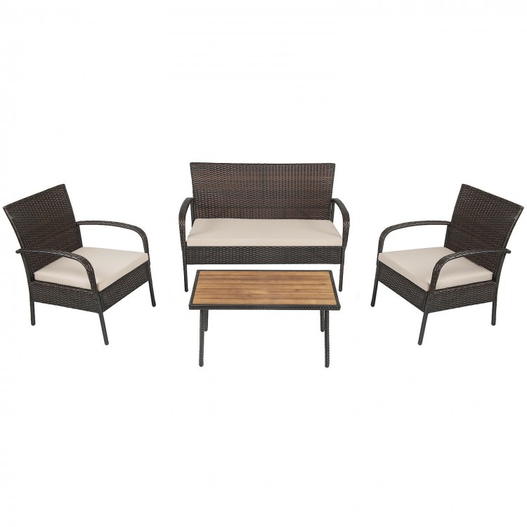 4-piece patio cushioned wicker conversation set with acacia wood tabletop, ideal for outdoor and indoor use.