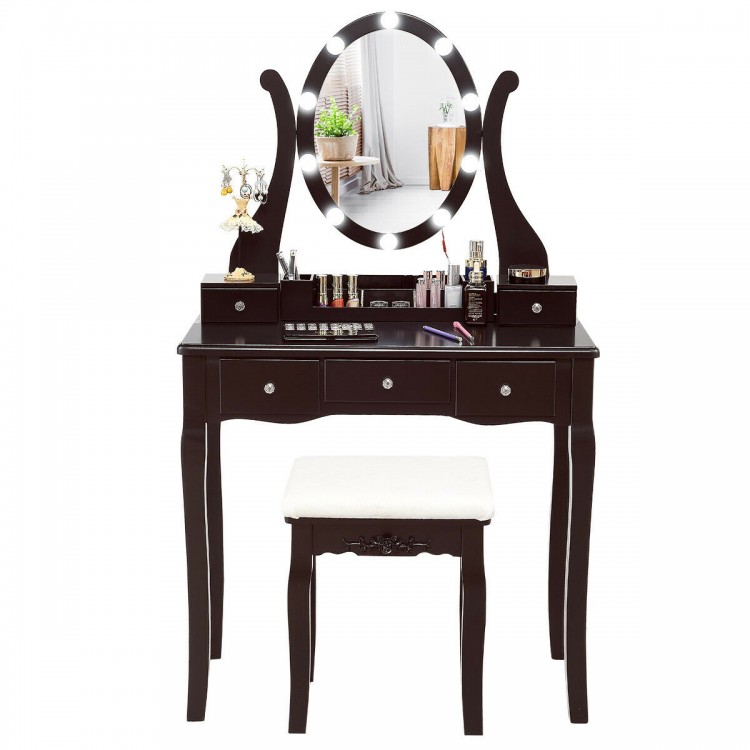 Elegant brown vanity table set with lighted mirror, cushioned stool, and five drawers for ample storage.