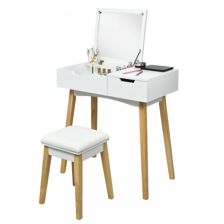 Wooden vanity table with flip top mirror, cushioned stool, and spacious storage for makeup and accessories.