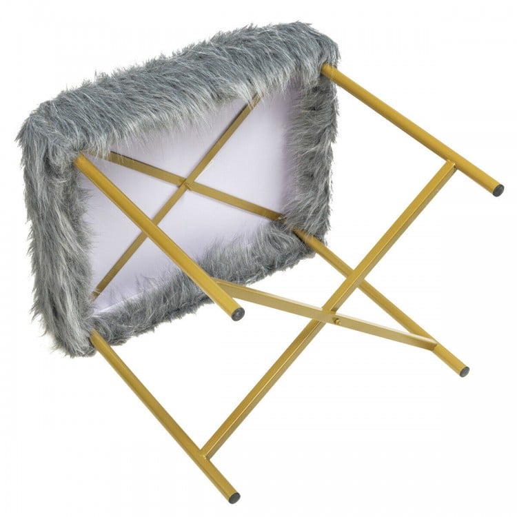 Underside view of gray faux fur ottoman stool with golden metal legs, highlighting its compact design and sturdy.