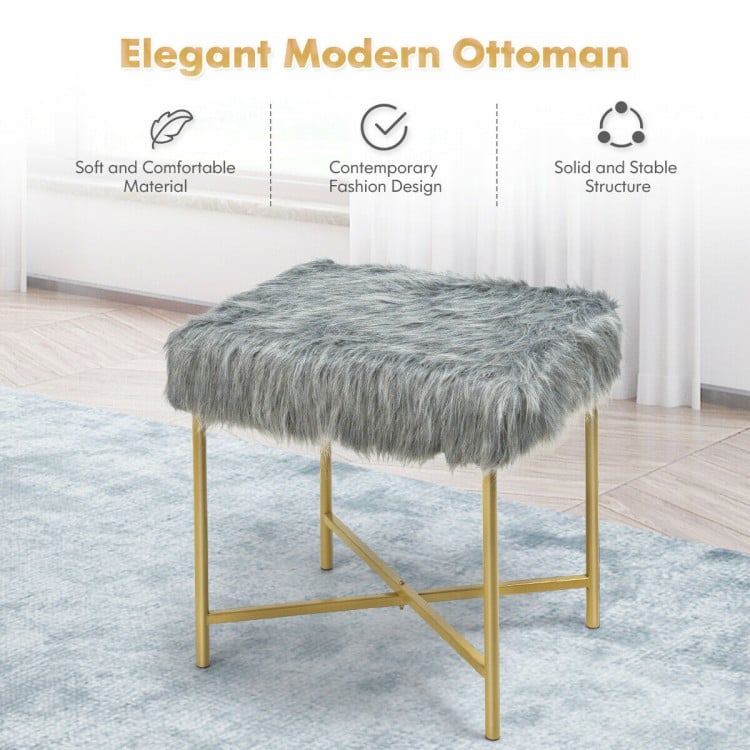 Gray faux fur ottoman with golden metal legs, stylish design for small spaces, ideal for bedroom or living room use.