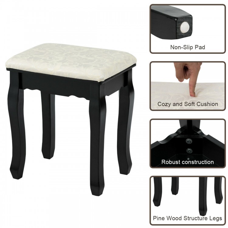 Black vanity stool with cushioned seat, featuring robust pine wood legs and non-slip pad for stability and comfort.