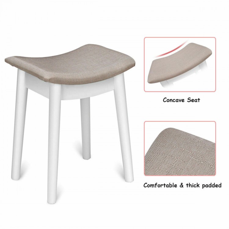 Concave seat stool with thick padding and elegant white legs, perfect for a vanity dressing table set.