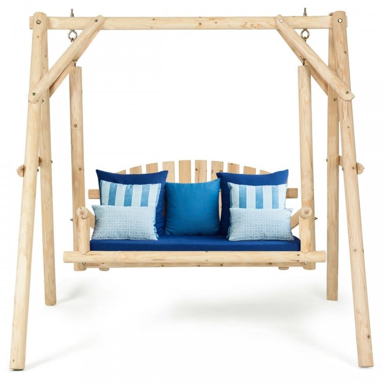 Outdoor wooden porch bench swing chair with rustic curved back and blue cushions, ideal for patio and garden relaxation.