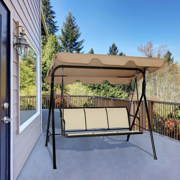 Three-person steel frame patio swing with adjustable brown canopy, ideal for outdoor relaxation on the porch or patio.