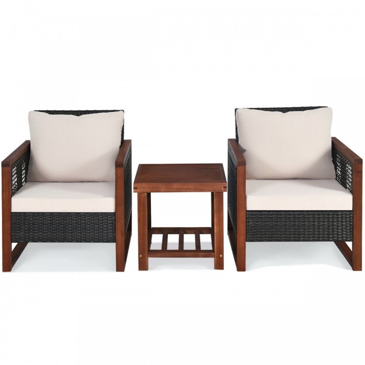 Two beige cushioned patio wicker chairs with a wooden coffee table, perfect for outdoor relaxation in your garden or.