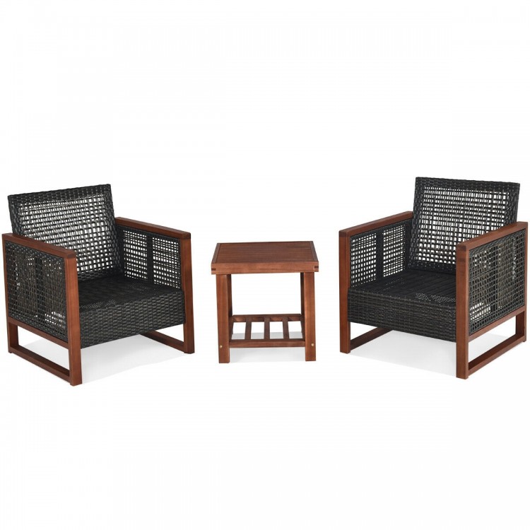 Two black wicker chairs with a wooden frame and a coffee table, perfect for outdoor patio relaxation.