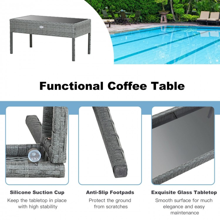 Coffee table with glass tabletop and anti-slip footpads, made of durable PE rattan for outdoor patio use.