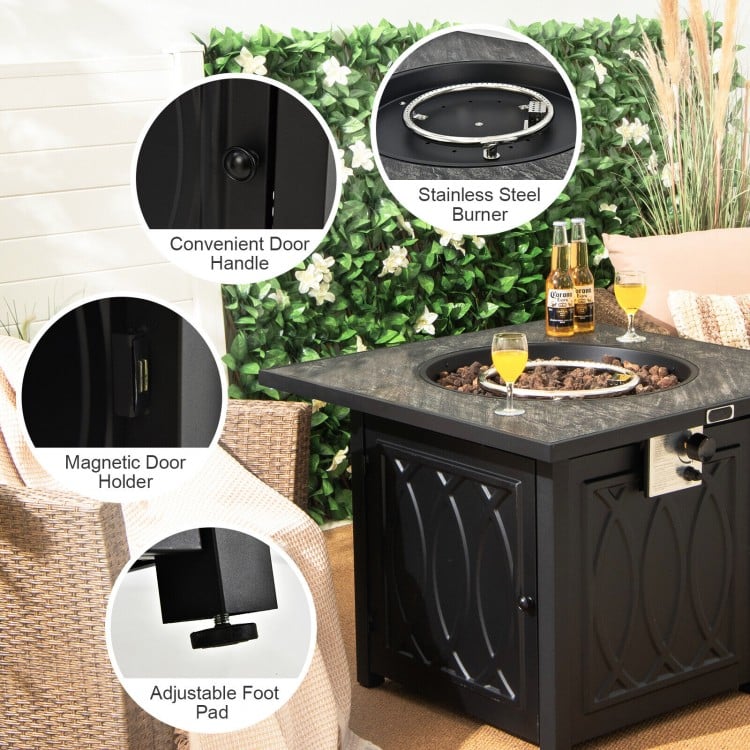 Close-up of the 32-inch propane fire pit table with stainless steel burner, adjustable foot pads, and lava rocks cover.
