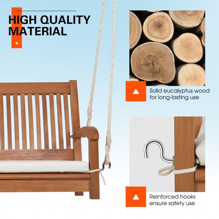 2-person hanging porch swing bench made of solid eucalyptus wood with cushion, ideal for backyard relaxation.