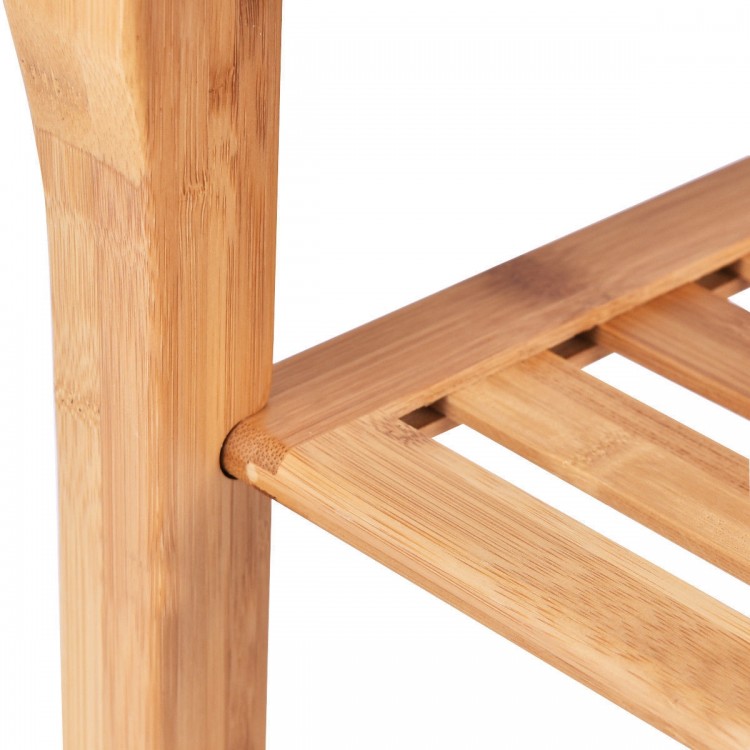 Close-up of the bamboo construction of a bathroom shower chair bench with a storage shelf, showcasing its smooth finish.