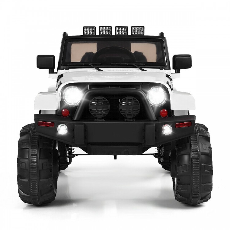 Front view of a 12V kids remote control riding truck car in white with LED lights and oversized wheels for fun driving.