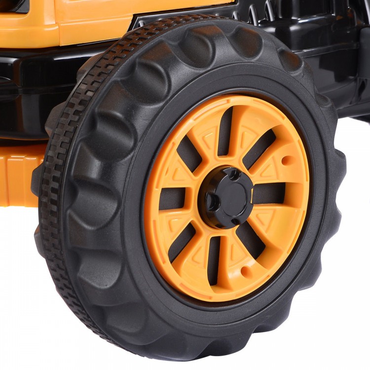 Close-up of the yellow tire on the 12 V battery-powered kids ride-on dumper truck, designed for outdoor play and.