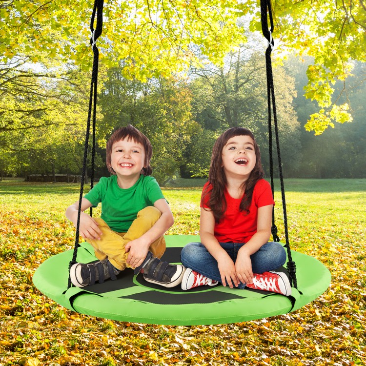 Kids enjoying the 40-inch green hanging chair swing tent set in a sunny outdoor setting, perfect for play and.