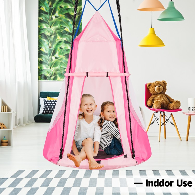 Kids sitting in a pink 2-in-1 hanging chair tent, perfect for indoor use, providing a cozy reading nook for multiple.