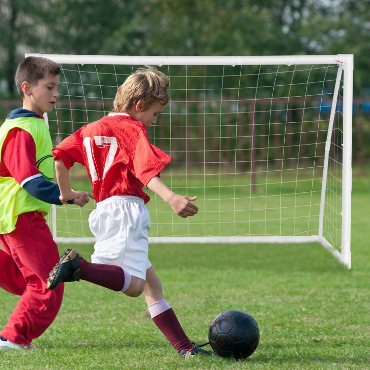 Kids playing soccer with a 6 x 4 feet portable goal featuring a strong UPVC frame, ideal for practice and fun.