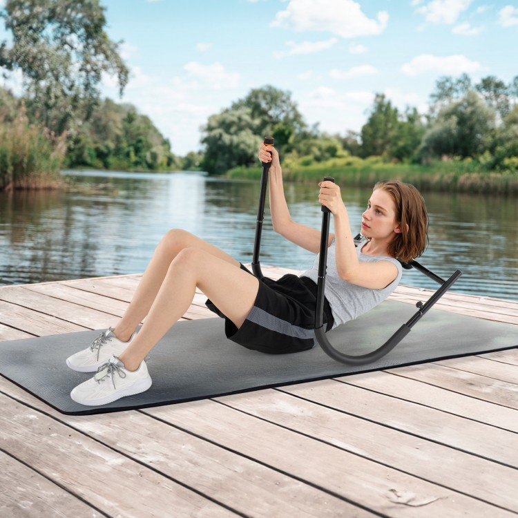 Fitness AB Trainer in black with padded support, used for sit-ups on a dock by the water for a total body workout.