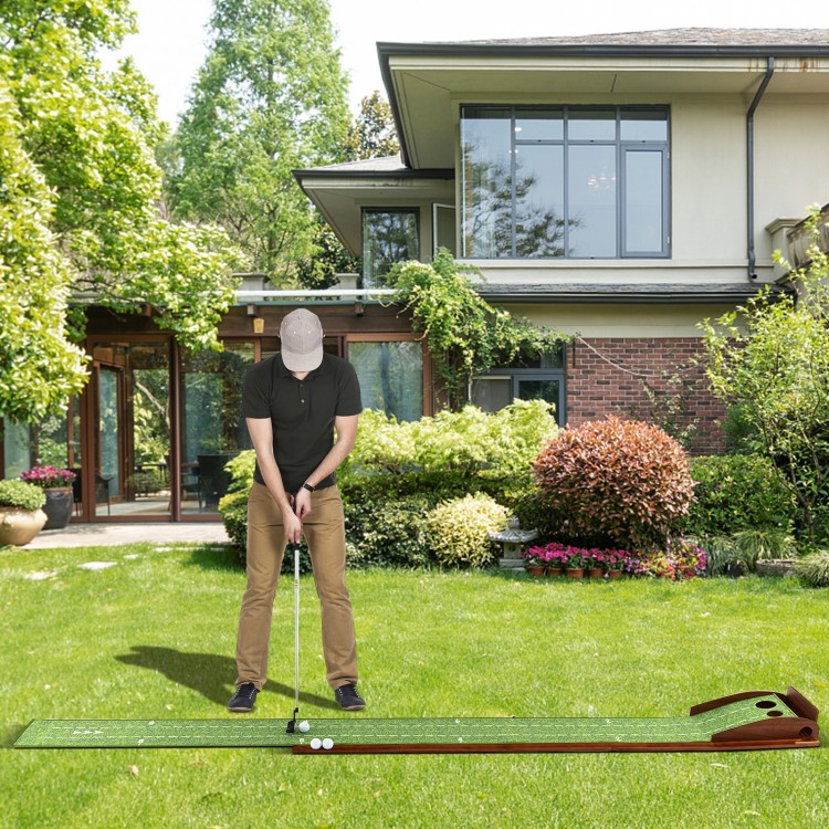 Golf putting mat with auto ball return, featuring two hole sizes, set up on a lawn for practice and training.
