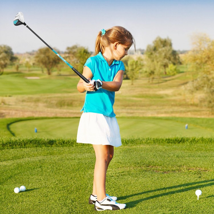 Junior golfer practicing with a blue golf club set, featuring a lightweight stand bag and adjustable straps for comfort.