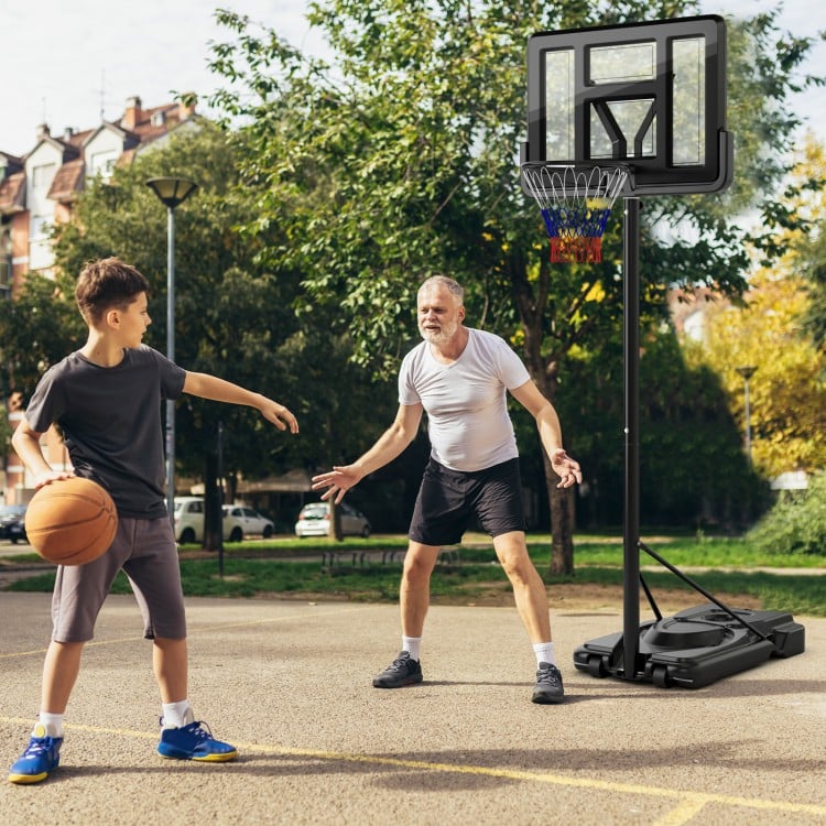 Portable basketball hoop with adjustable height, featuring a shatterproof backboard and sturdy base for outdoor play.