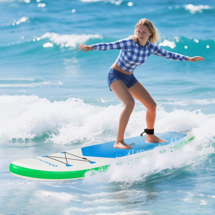 Young woman surfing on an 11 feet inflatable stand up paddle board with a non-slip deck in ocean waves.