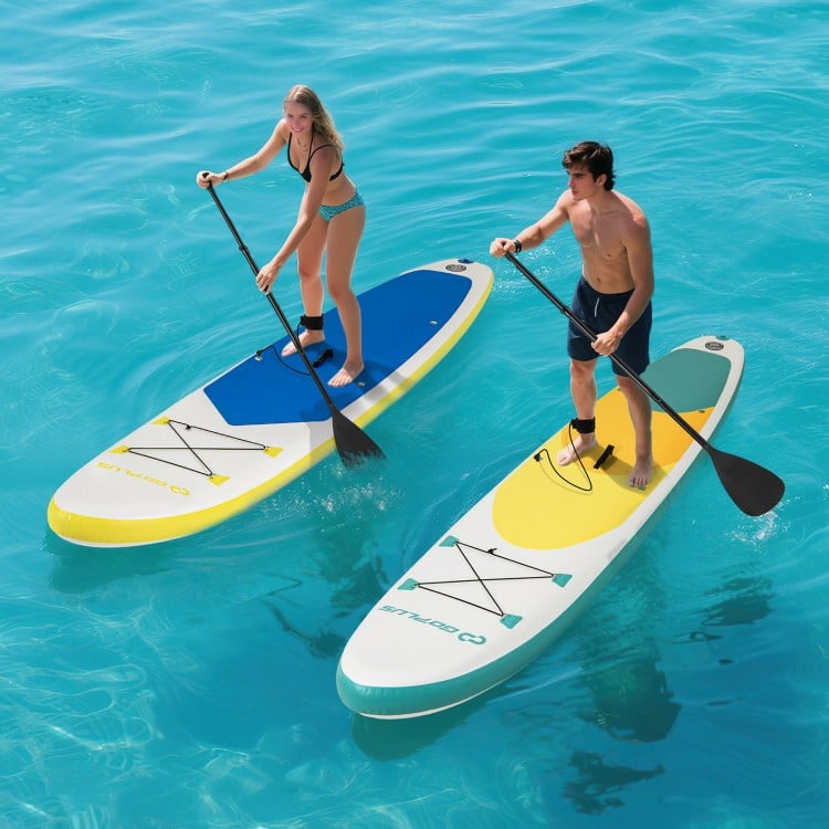 Two paddlers on 11 feet inflatable stand up paddle boards in blue and yellow, enjoying a day on the water.
