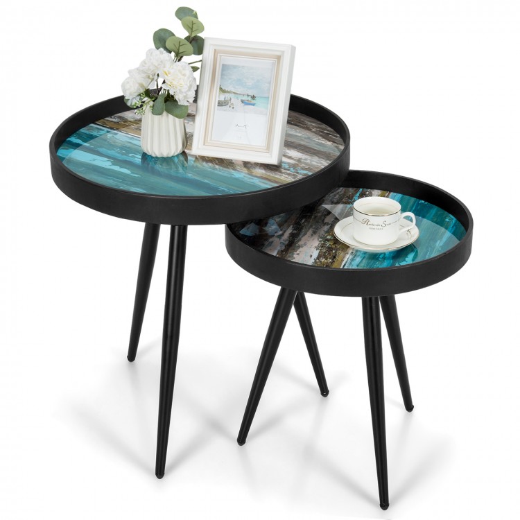 Set of 2 nesting end tables with wooden tray tops and black steel legs, perfect for modern living spaces.