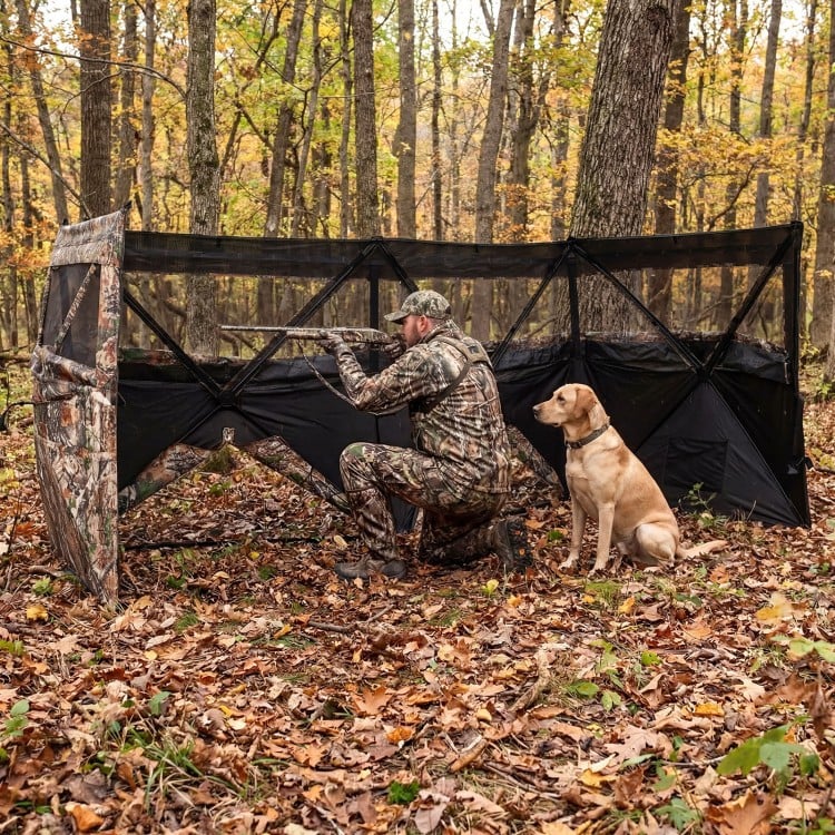Pop-up hunting blind with camouflage pattern, featuring adjustable windows and dog door, ideal for 1-3 people in the.