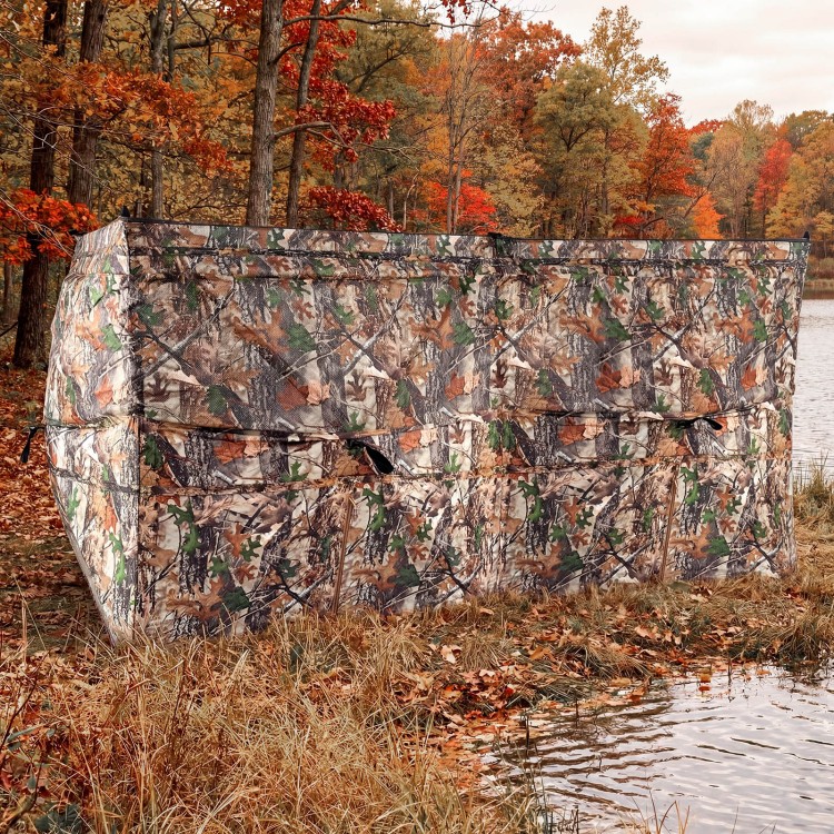 Pop-up hunting blind with camouflage pattern, featuring adjustable windows and dog doors, ideal for 1-3 people.