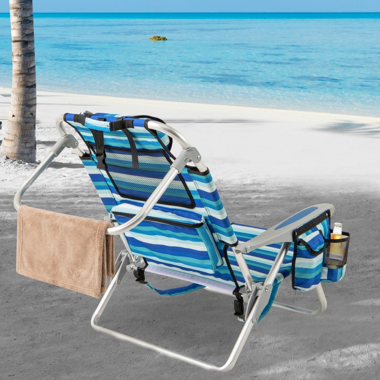 Folding beach chair with adjustable backrest, sturdy aluminum frame, and side pocket, perfect for outdoor relaxation.