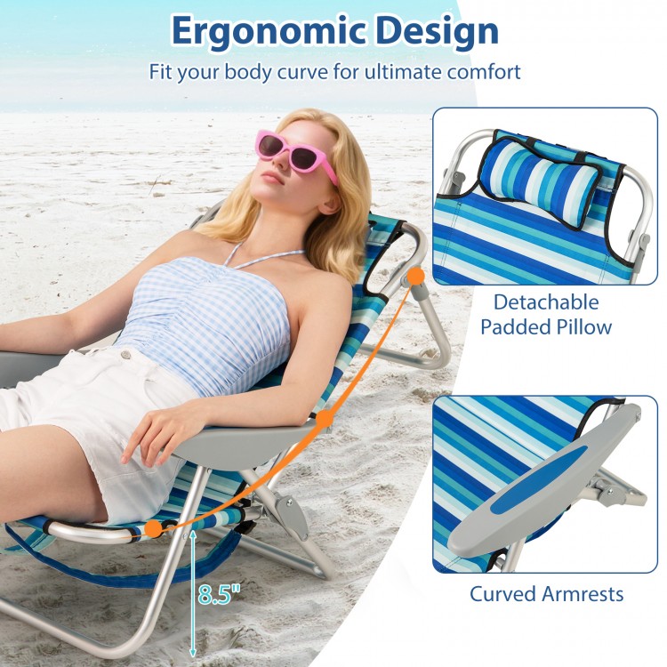 Folding beach chair with adjustable backrest, padded pillow, and curved armrests for ultimate comfort and relaxation.